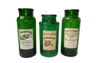 SET OF THREE GREEN GLASS STORAGE JARS