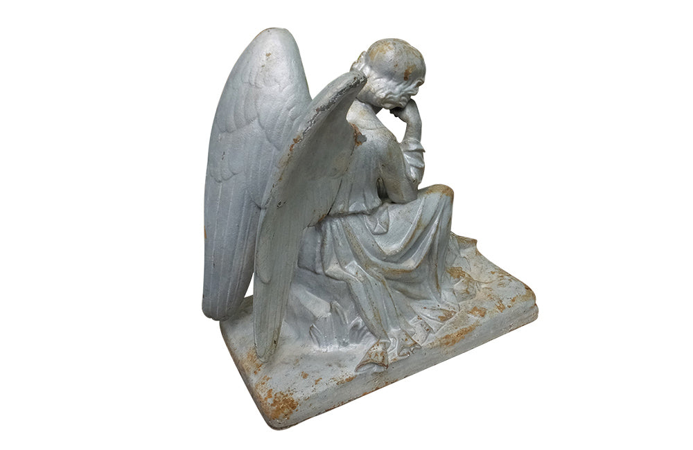 SEATED CAST IRON ANGEL STATUE