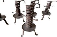 COLLECTION OF FIVE FRENCH IRON CELLAR CANDLESTICKS