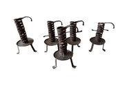 COLLECTION OF FIVE FRENCH IRON CELLAR CANDLESTICKS