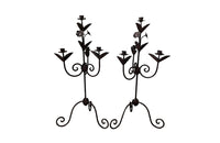 Pair of large wrought iron candle holders from a chateau in the Dordorgne. Tall decorative candlesticks with floral and foliate decoration and have 4 candle holders.