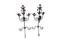 Pair of large wrought iron candle holders from a chateau in the Dordorgne. Tall decorative candlesticks with floral and foliate decoration and have 4 candle holders.