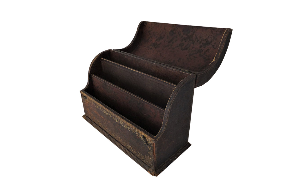 Charming French lidded file box in lovely old worn leather with Neo-Classical embossed motifs, including swans and urns . The base bears the original retail label of Au Bon Marche.