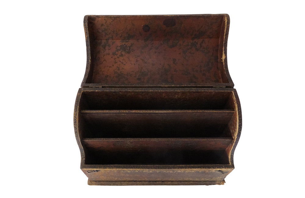 Charming French lidded file box in lovely old worn leather with Neo-Classical embossed motifs, including swans and urns . The base bears the original retail label of Au Bon Marche.