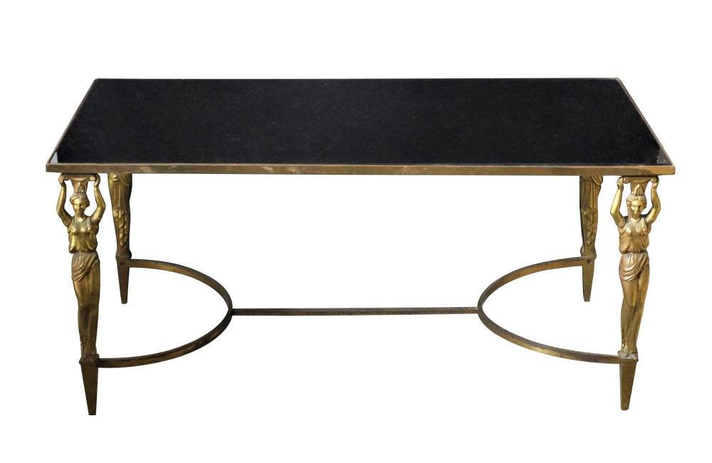 Mid Century French Coffee Table in the Neo-Classical style with brass female caryatids supporting a brass framed black glass top - French Mid Century Furniture - AD & PS Antiques
