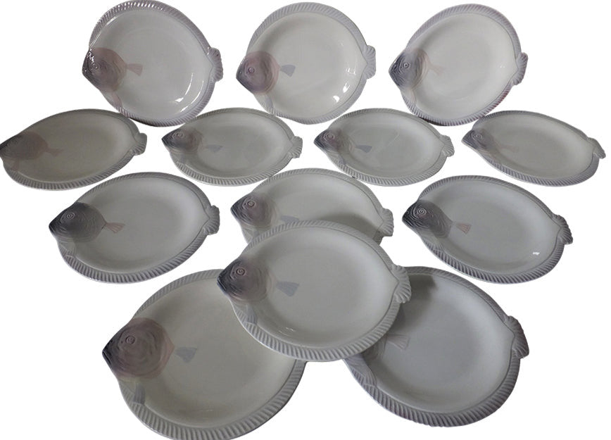 Twelve Antique seafood plates in the form of fish by Longwy - French Antiques