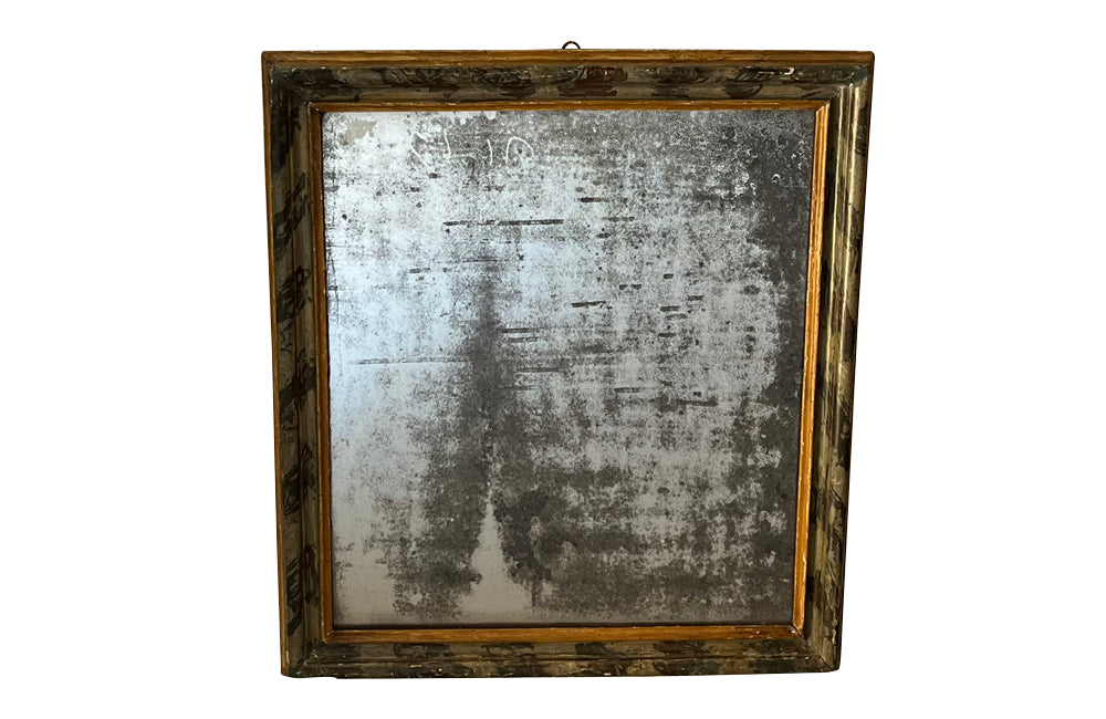 Antique mirror with polychrome frame from the Piedmont region. Italian. With beautiful heavily foxed mirror.