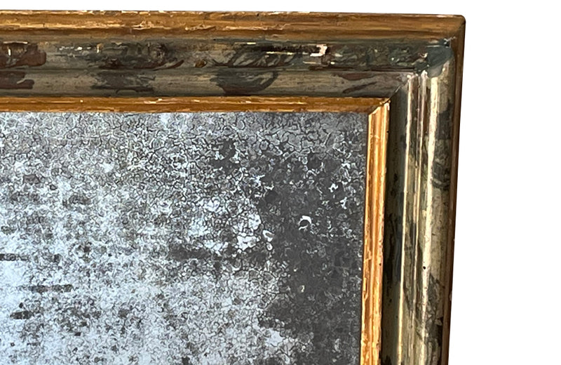Antique mirror with polychrome frame from the Piedmont region. Italian. With beautiful heavily foxed mirror.