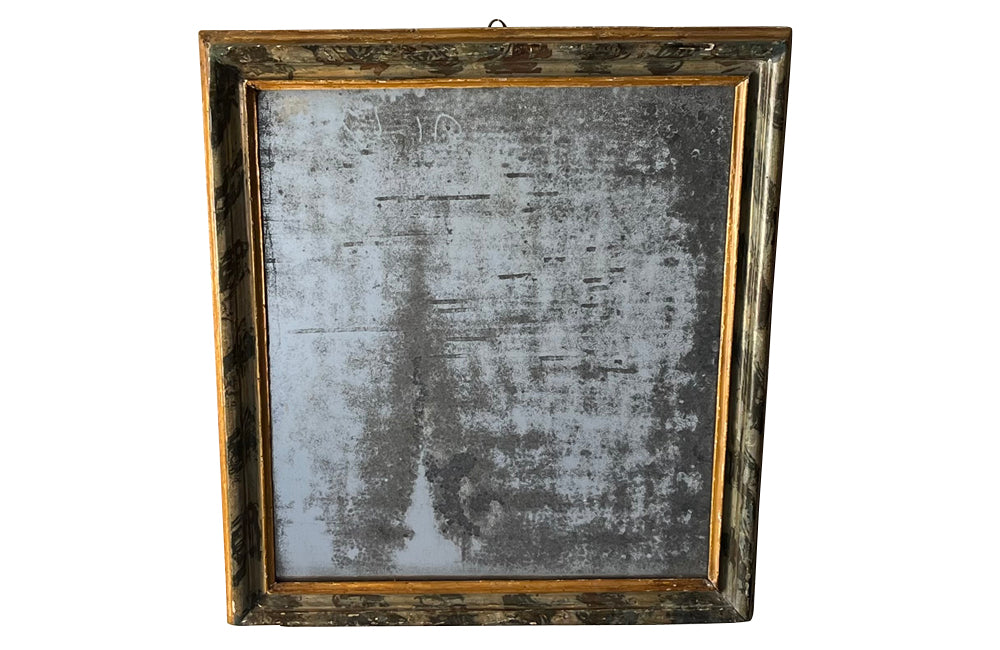Antique mirror with polychrome frame from the Piedmont region. Italian. With beautiful heavily foxed mirror.