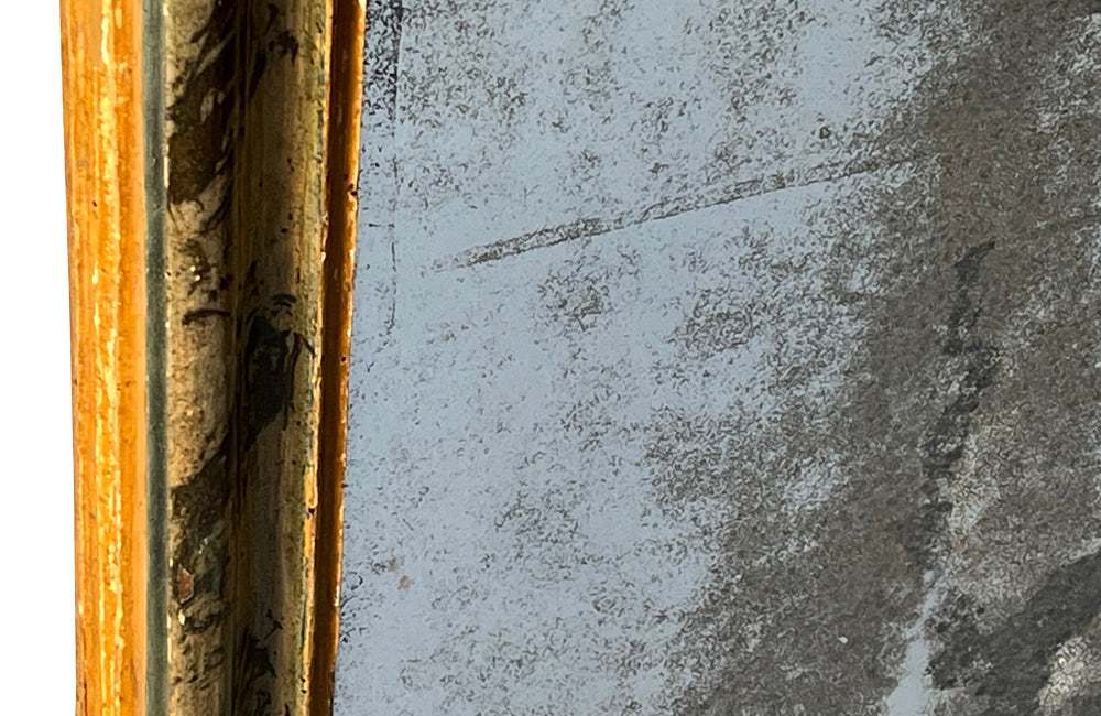 Antique mirror with polychrome frame from the Piedmont region. Italian. With beautiful heavily foxed mirror.