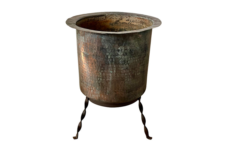 Beautiful 18th century French hammered and riveted copper vat on a later iron stand.