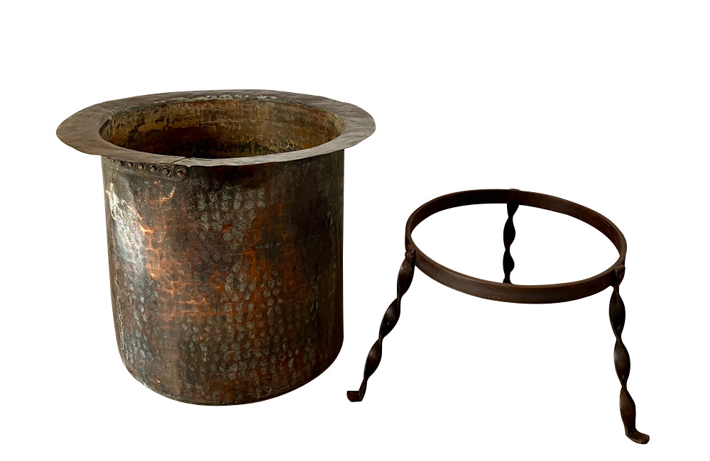 Beautiful 18th century French hammered and riveted copper vat on a later iron stand.