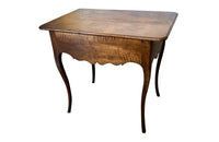 18th century French Louis XV walnut writing table with shaped apron to all sides and one drawer