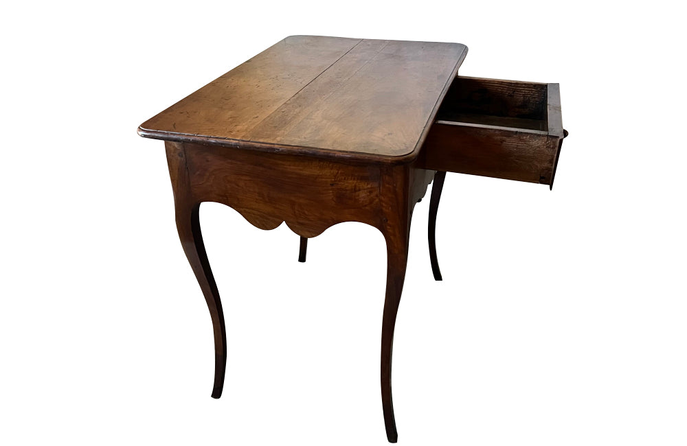 18th century French Louis XV walnut writing table with shaped apron to all sides and one drawer - Antique Tables