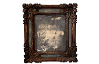 Beautiful early 18th Century French carved gilt wood cushion mirror with foxed glass