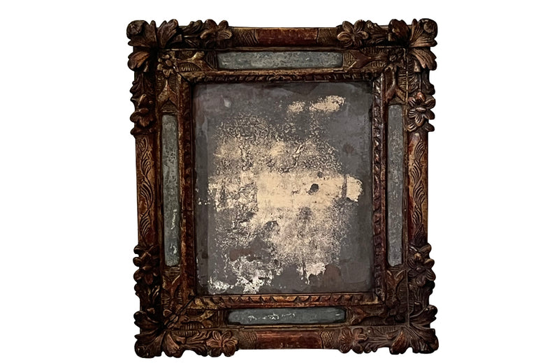 Beautiful early 18th Century French carved gilt wood cushion mirror with foxed glass