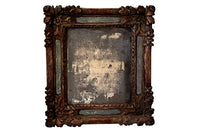 Beautiful early 18th Century French carved gilt wood cushion mirror with foxed glass