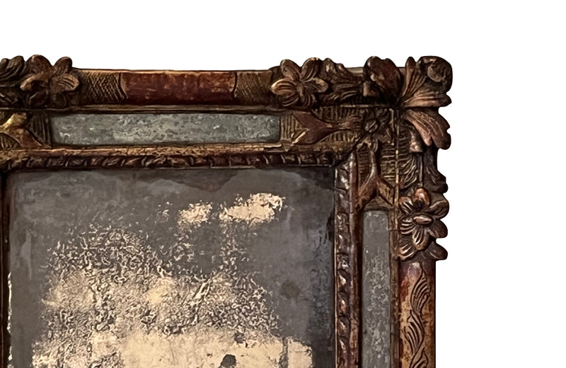 Beautiful early 18th Century French carved gilt wood cushion mirror with foxed glass