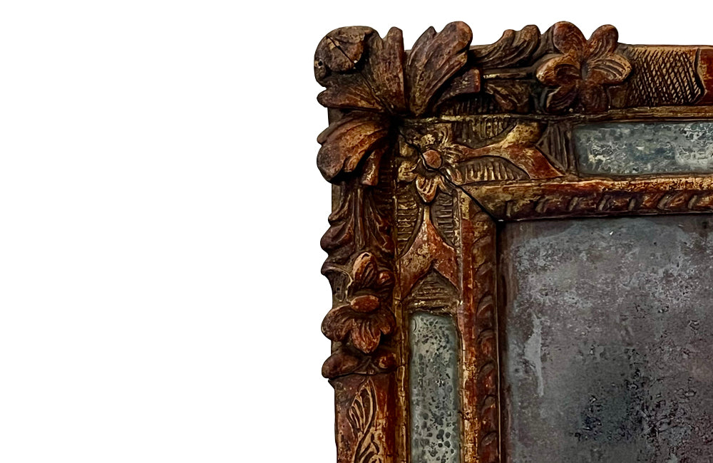 Beautiful early 18th Century French carved gilt wood cushion mirror with foxed glass
