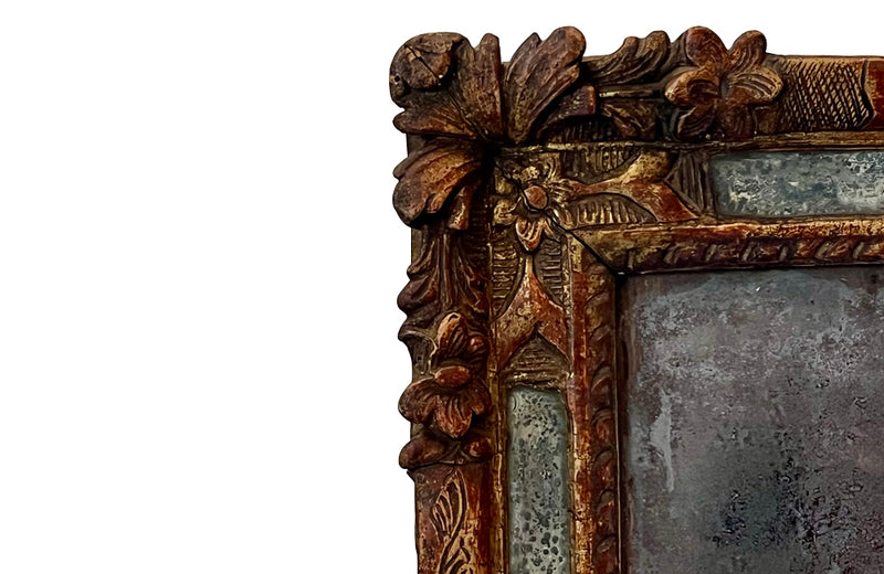Beautiful early 18th Century French carved gilt wood cushion mirror with foxed glass