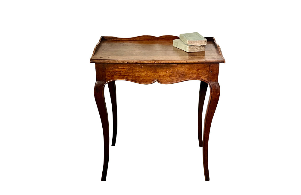 Pretty 18th Century French, Louis XV Period, walnut writing table.