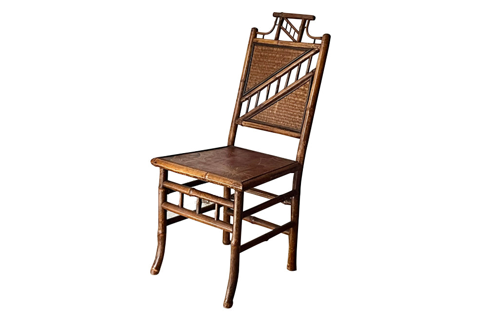 Antique chair made of bamboo with embossed leather seat 