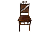 Antique chair made of bamboo with embossed leather seat 