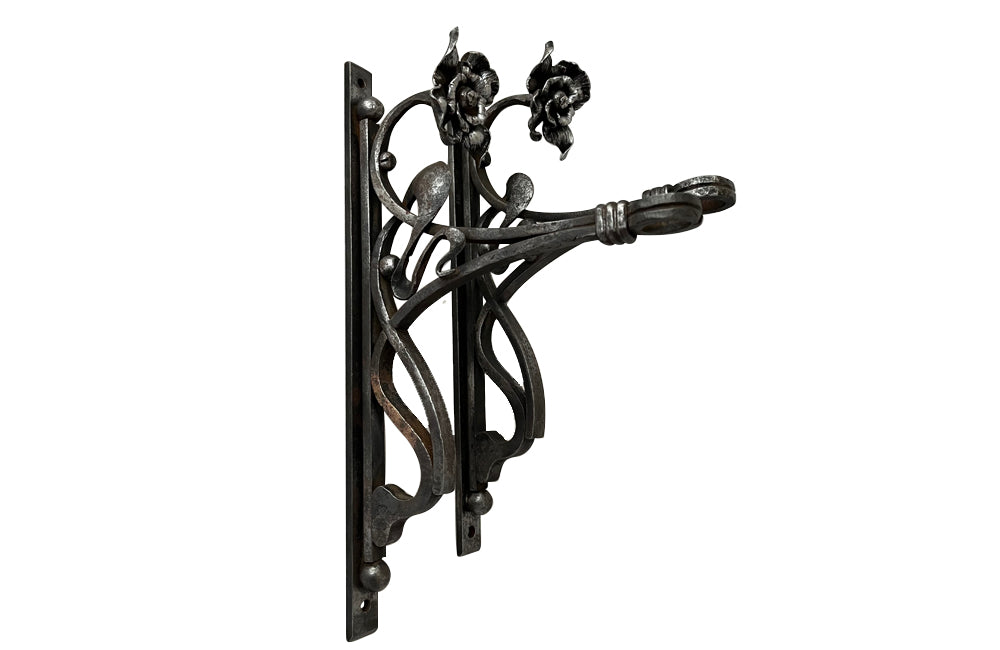 Pair of beautiful 19th Century Art Nouveau iron wall brackets of lovely quality.