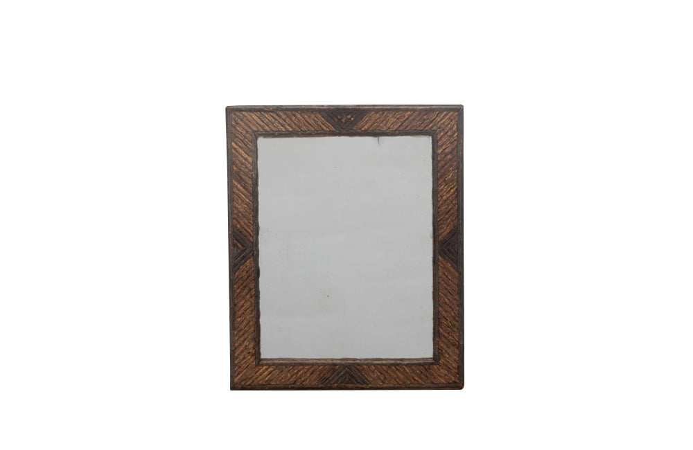 Charming tramp art framed mirror made with hazelnut twigs circa late 19th century.