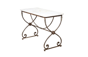 Beautiful 19th century French iron based table with lead medallions and ornamentation to arched stretcher and top of legs.