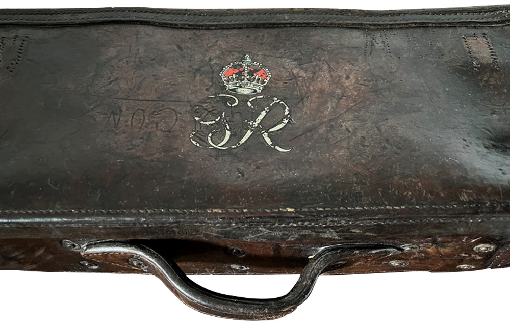 19th century leather lidded box with brass side handles and brass ball feet. Bears a later Crowned Royal Monogram of G.R.