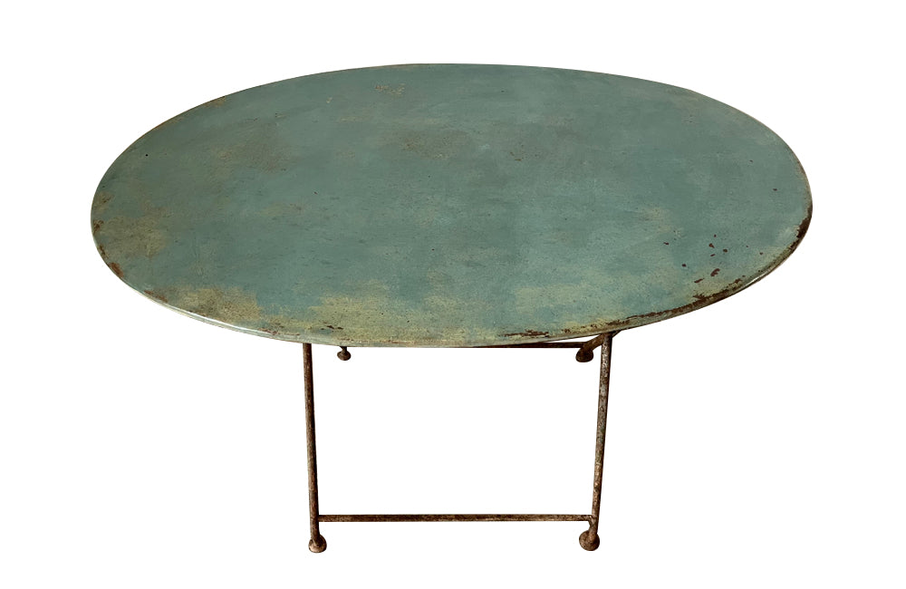 19th century French folding oval iron garden table with lovely blue colour and patination