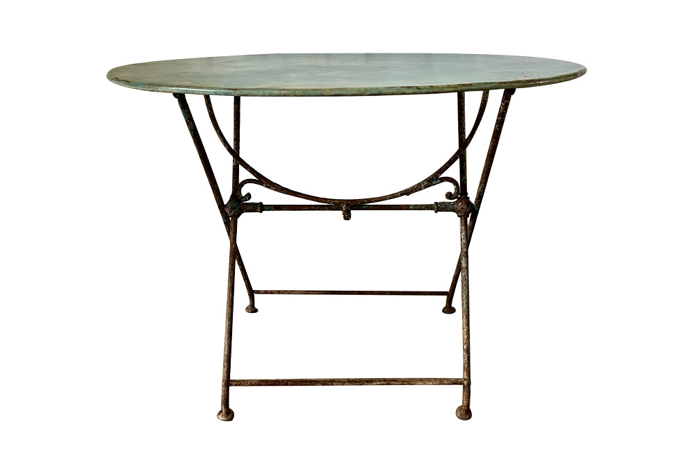 19th century French folding oval iron garden table with lovely blue colour and patination