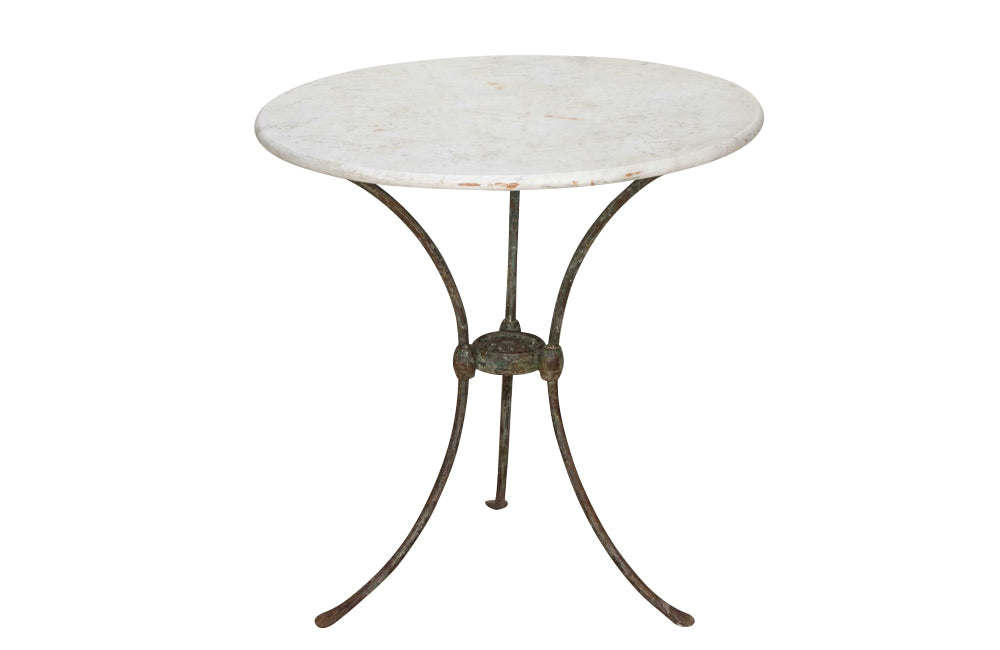 Antique iron garden table with splayed legs and pretty cast iron central floral medallion. Garden antiques