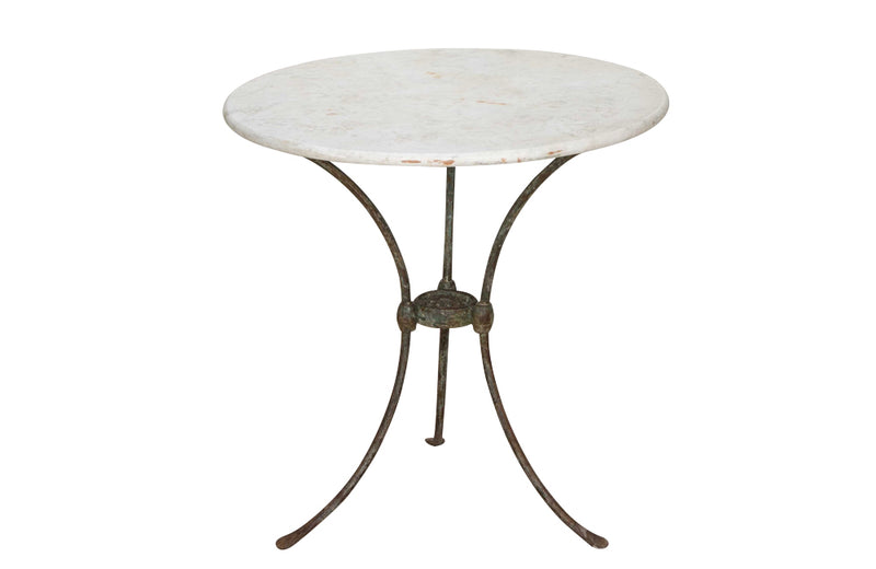 Antique iron garden table with splayed legs and pretty cast iron central floral medallion. Garden antiques