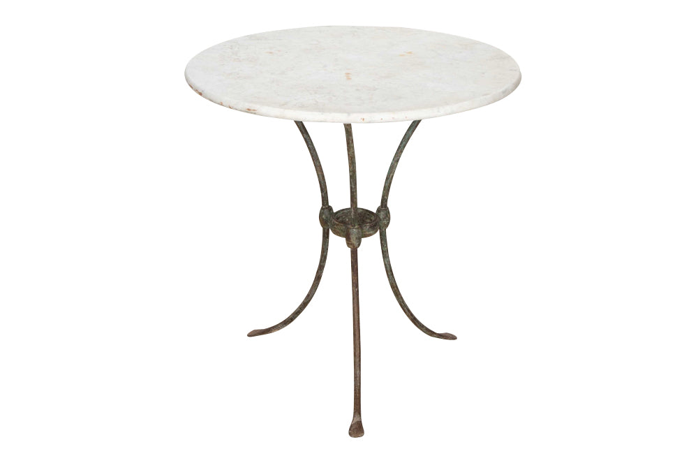 Antique iron garden table with splayed legs and pretty cast iron central floral medallion. Garden antiques
