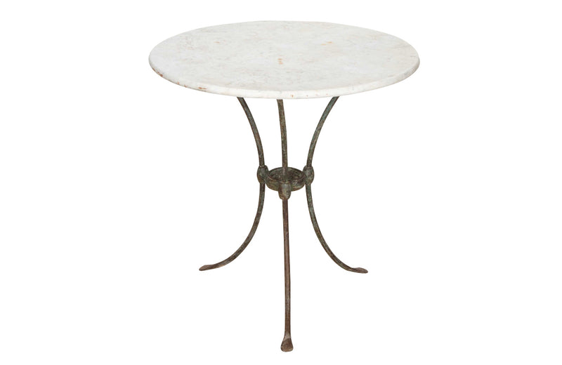 Antique iron garden table with splayed legs and pretty cast iron central floral medallion. Garden antiques