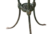 Antique iron garden table with splayed legs and pretty cast iron central floral medallion. Garden antiques