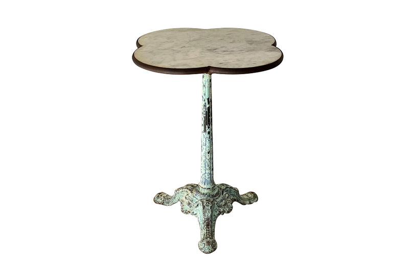 Antique bistro table with quatrefoil clover shaped marble top and enamelled iron base. French. foundry stamps to feet of Charlionais Pourailly & Cie