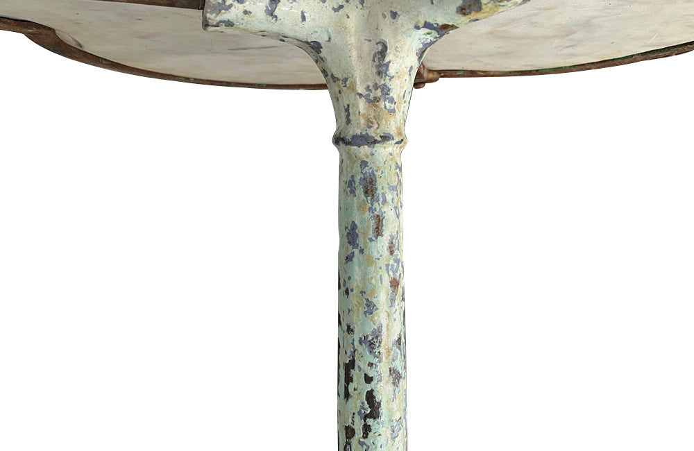 Antique bistro table with quatrefoil clover shaped marble top and enamelled iron base. French. foundry stamps to feet of Charlionais Pourailly & Cie