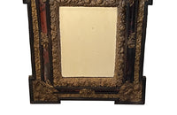Antique mirror Louis XIV style French with faux tortoiseshell veneer and repousee brass decoration. Richly decorated with floral, foliate and fruit motif.