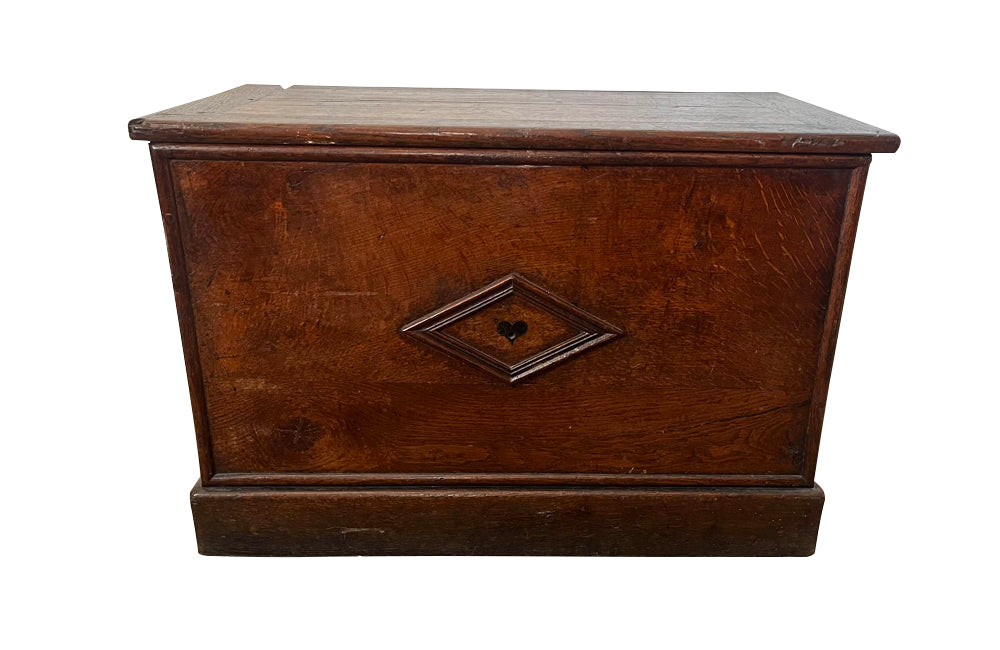 Charming 19th Century French lidded oak trunk with heart motif.