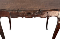 Small 19th Century French oak writing table in the Louis XV style.
