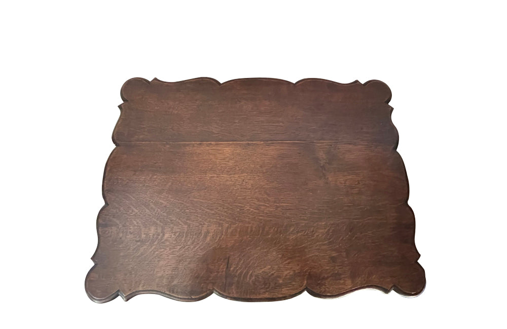 Small 19th Century French oak writing table in the Louis XV style.