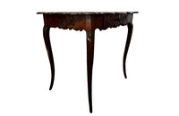 Small 19th Century French oak writing table in the Louis XV style.