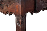 Small 19th Century French oak writing table in the Louis XV style.