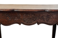 Small 19th Century French oak writing table in the Louis XV style.