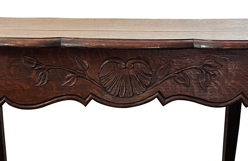 Small 19th Century French oak writing table in the Louis XV style.