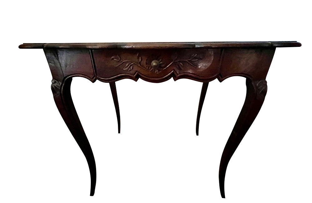 Small 19th Century French oak writing table in the Louis XV style.