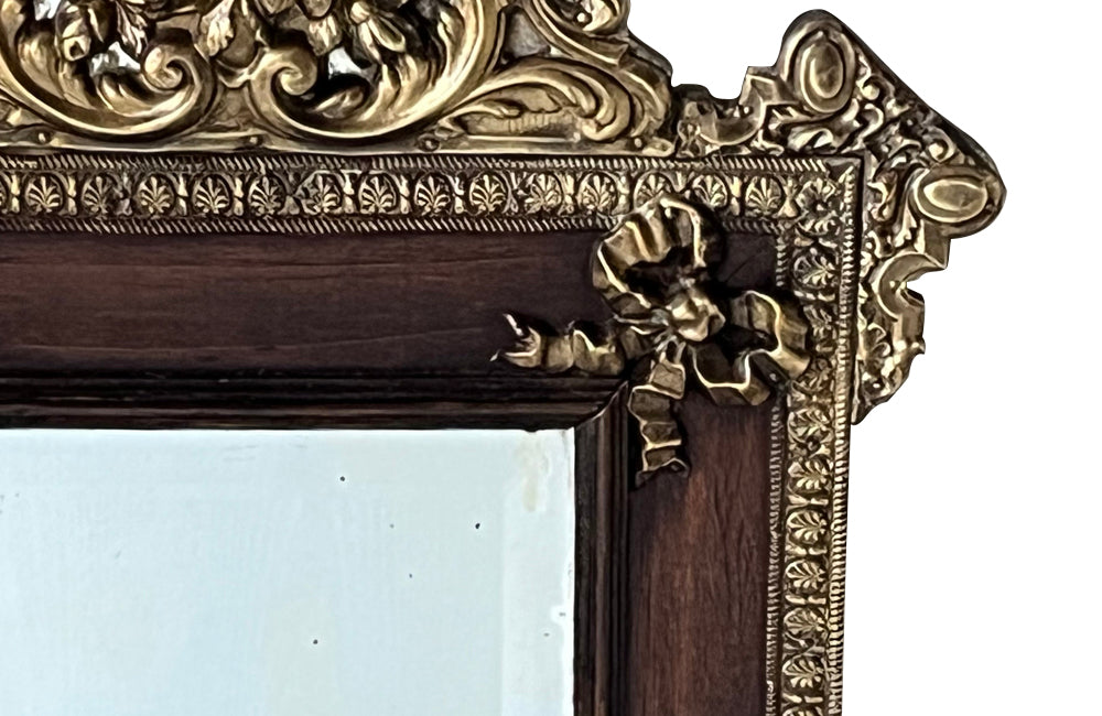 Antique mirror 19th Century French. With brass and glass floral ornamented pediment.